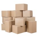 A large stack of plain cardboard boxes sits against a stark white background. The tape keeps the boxes closed.