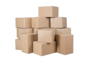 A large stack of plain cardboard boxes sits against a stark white background. The tape keeps the boxes closed.