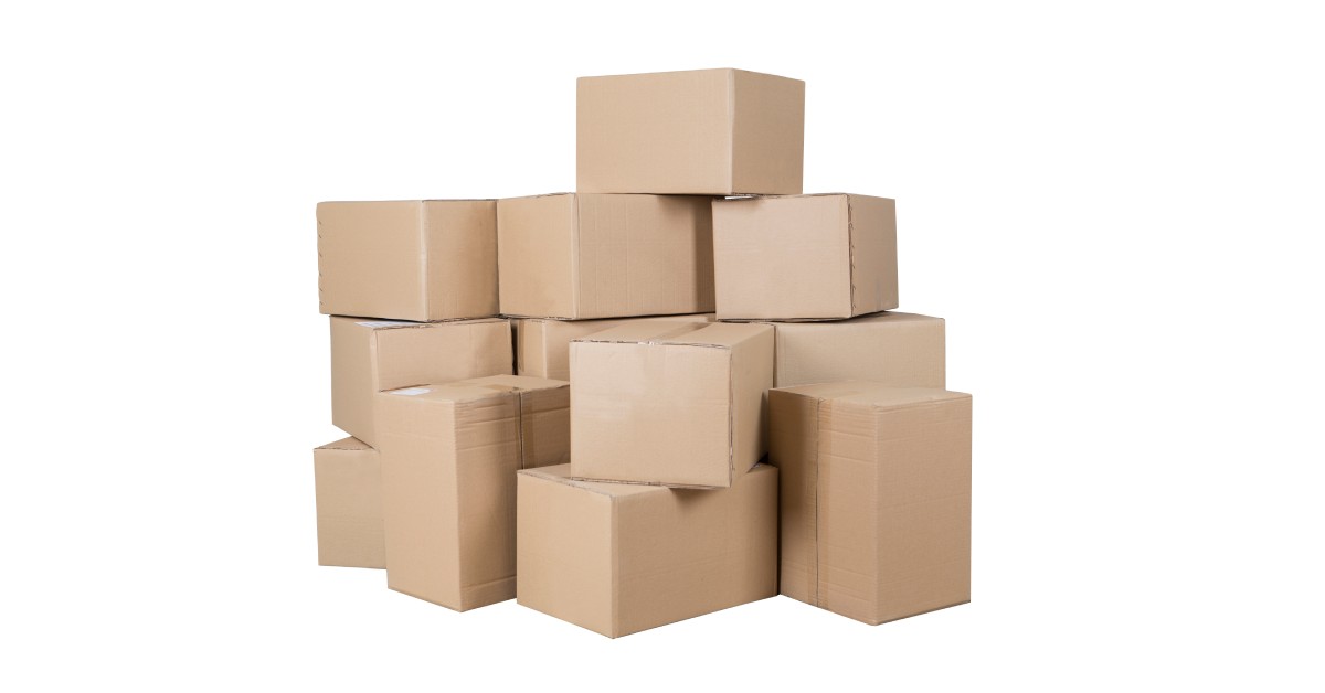 A large stack of plain cardboard boxes sits against a stark white background. The tape keeps the boxes closed.